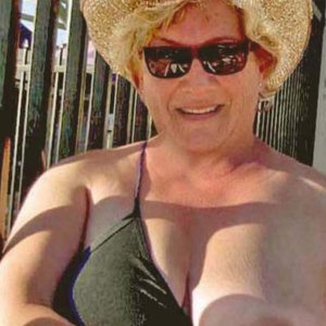 Busty mature flashing husband and his friend in public