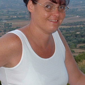 Wife on holiday fully clothed giving a cute smile..